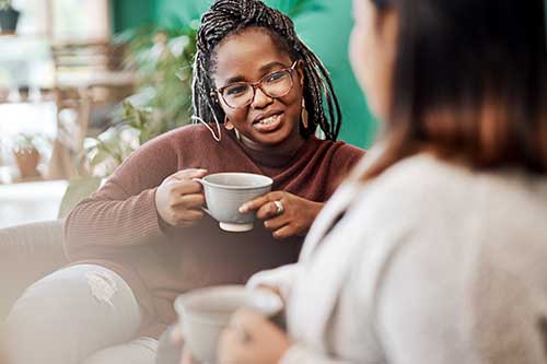 woman in residential treatment talks to peer