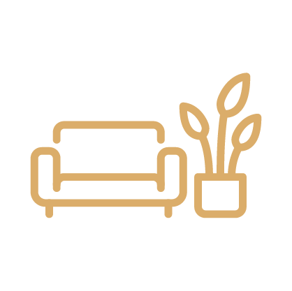 a couch and plant in a pot
