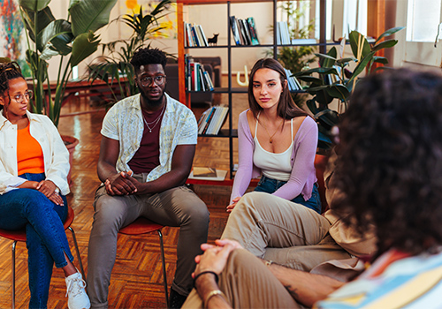 a group of young men and women meet with an addiction treatment specialist as part of a fentanyl detox program