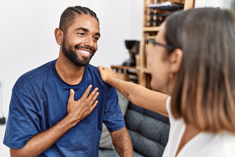 a woman touching a man's chest