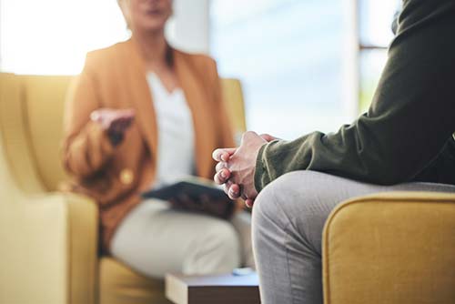 a man and woman sitting in chairs