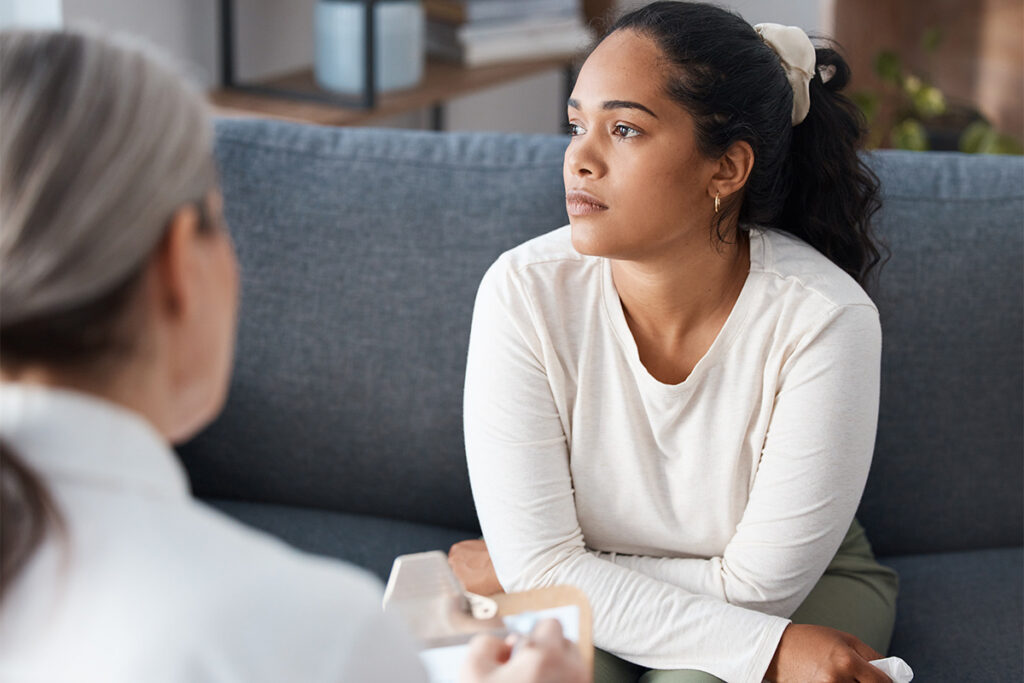Woman thinking deeply while in therapy